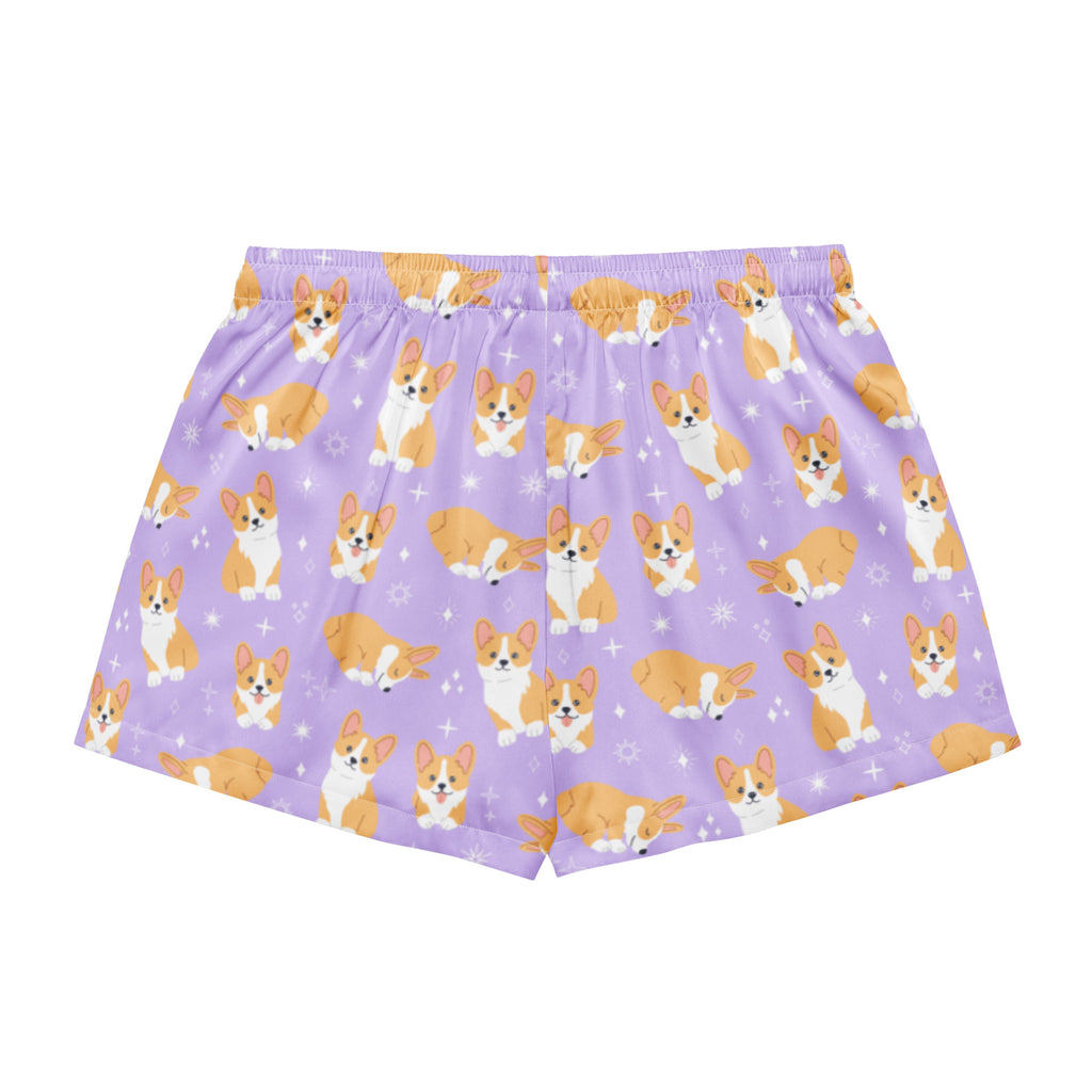 Women’s purple silky pajama boxer shorts with playful orange and white corgi pattern and small star accents