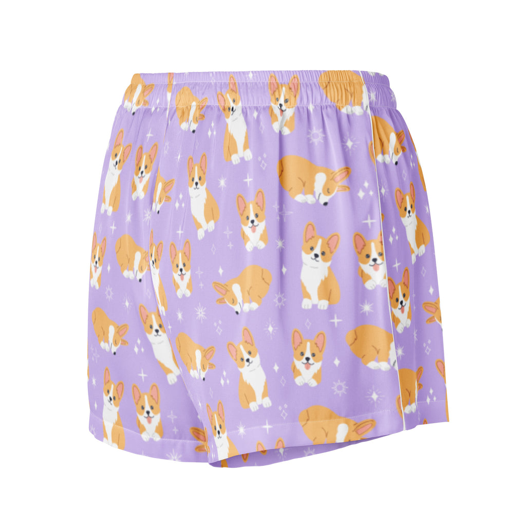 Women’s purple silky pajama shorts with playful orange and white corgi pattern and small star accents with drawstring waist