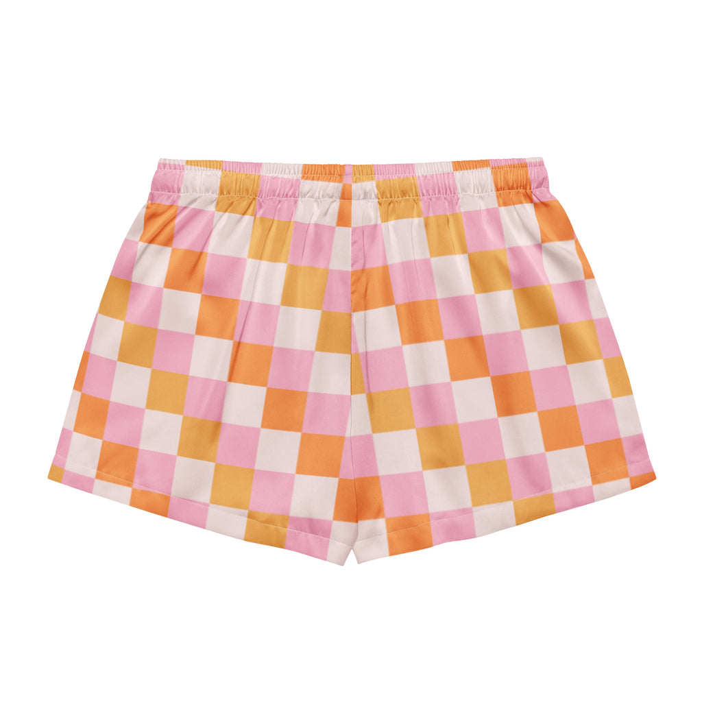 Women’s pastel pink and orange checkered silky pajama shorts with lightweight relaxed fit and elastic waistband