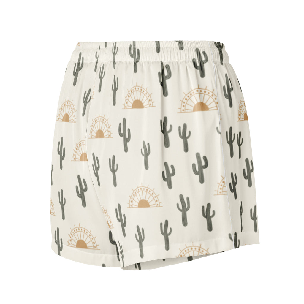 Women’s silky pajama shorts in white with gray cactus and tan sunburst patterns featuring a relaxed fit and drawstring waist