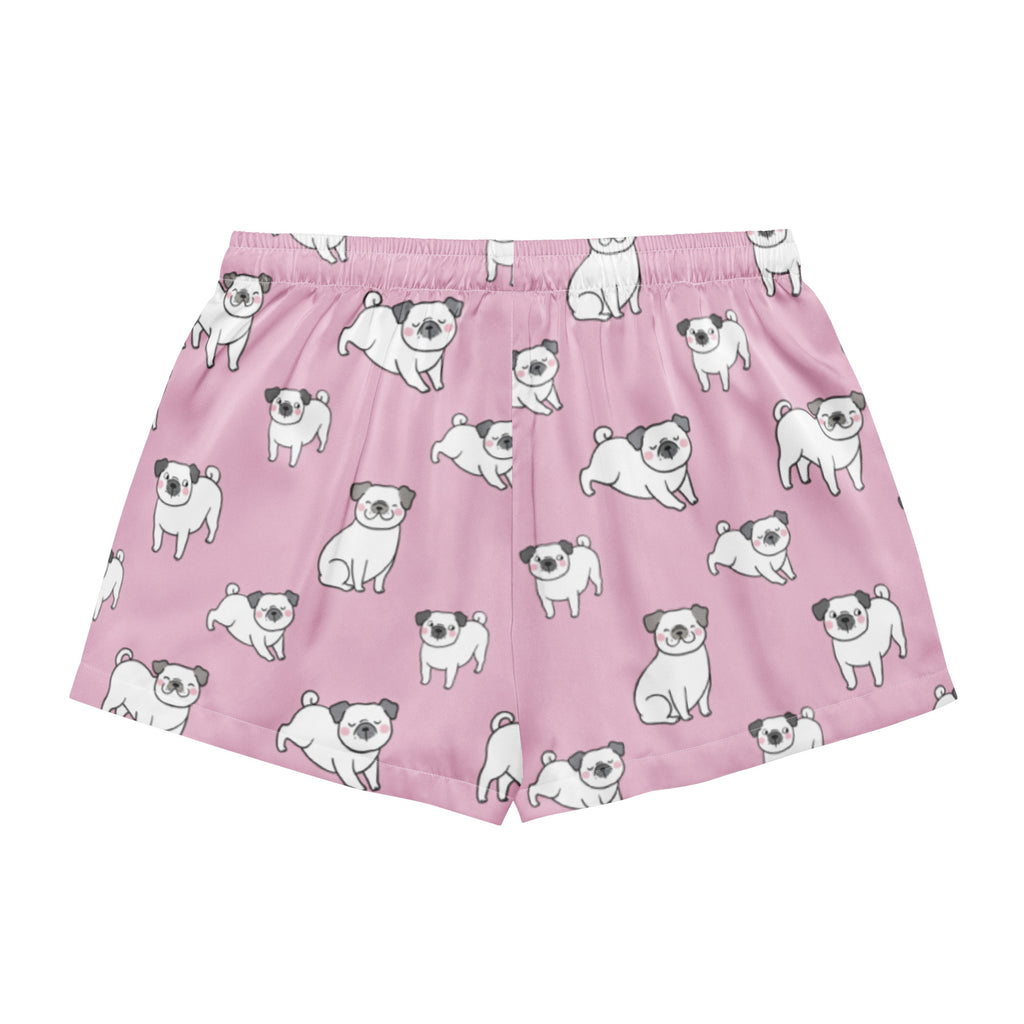 Women’s pink silky pajama shorts with a playful white pug pattern black ears and noses lightweight relaxed fit