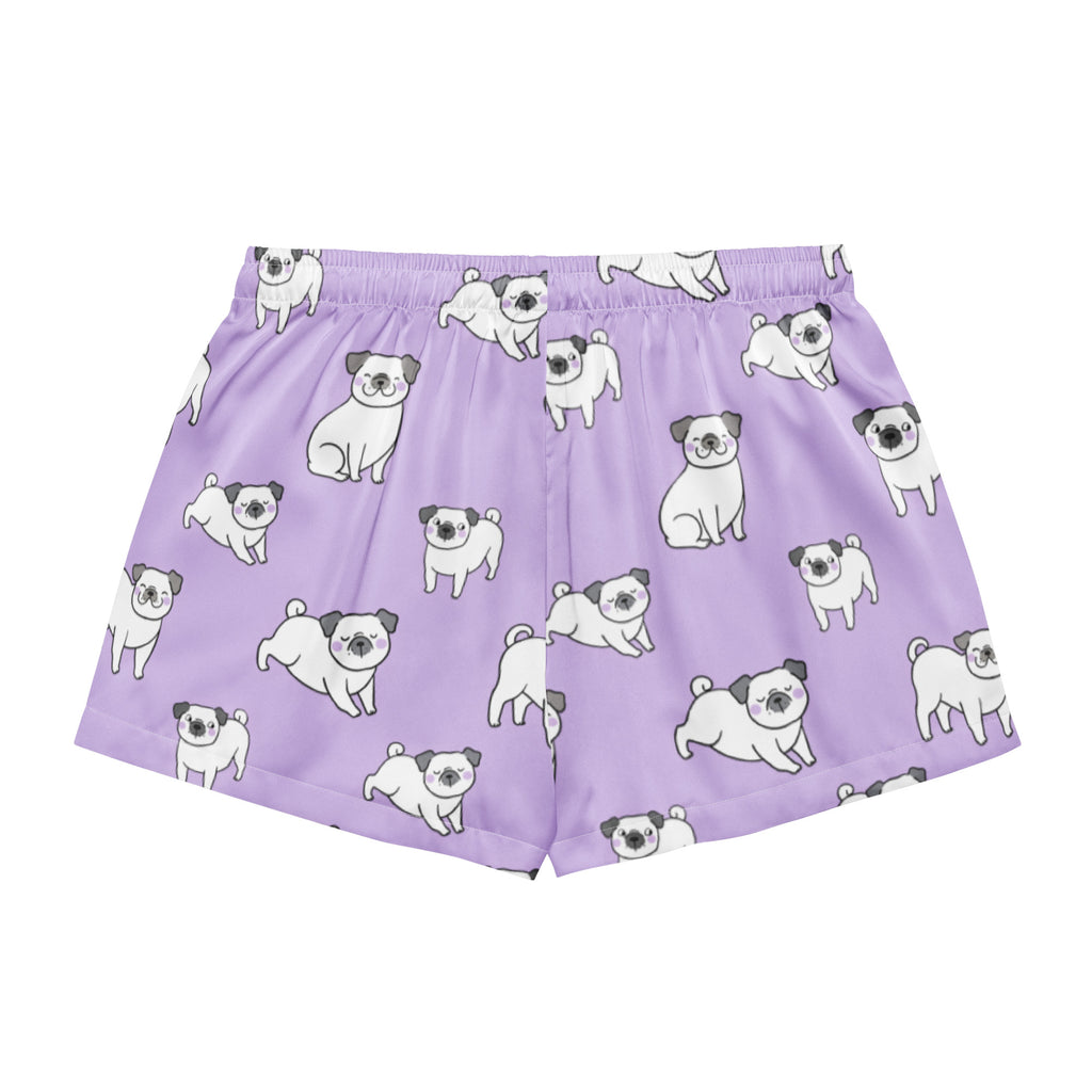 Women’s purple silky pajama shorts featuring a playful white pug pattern with black ears and noses and a drawstring waist