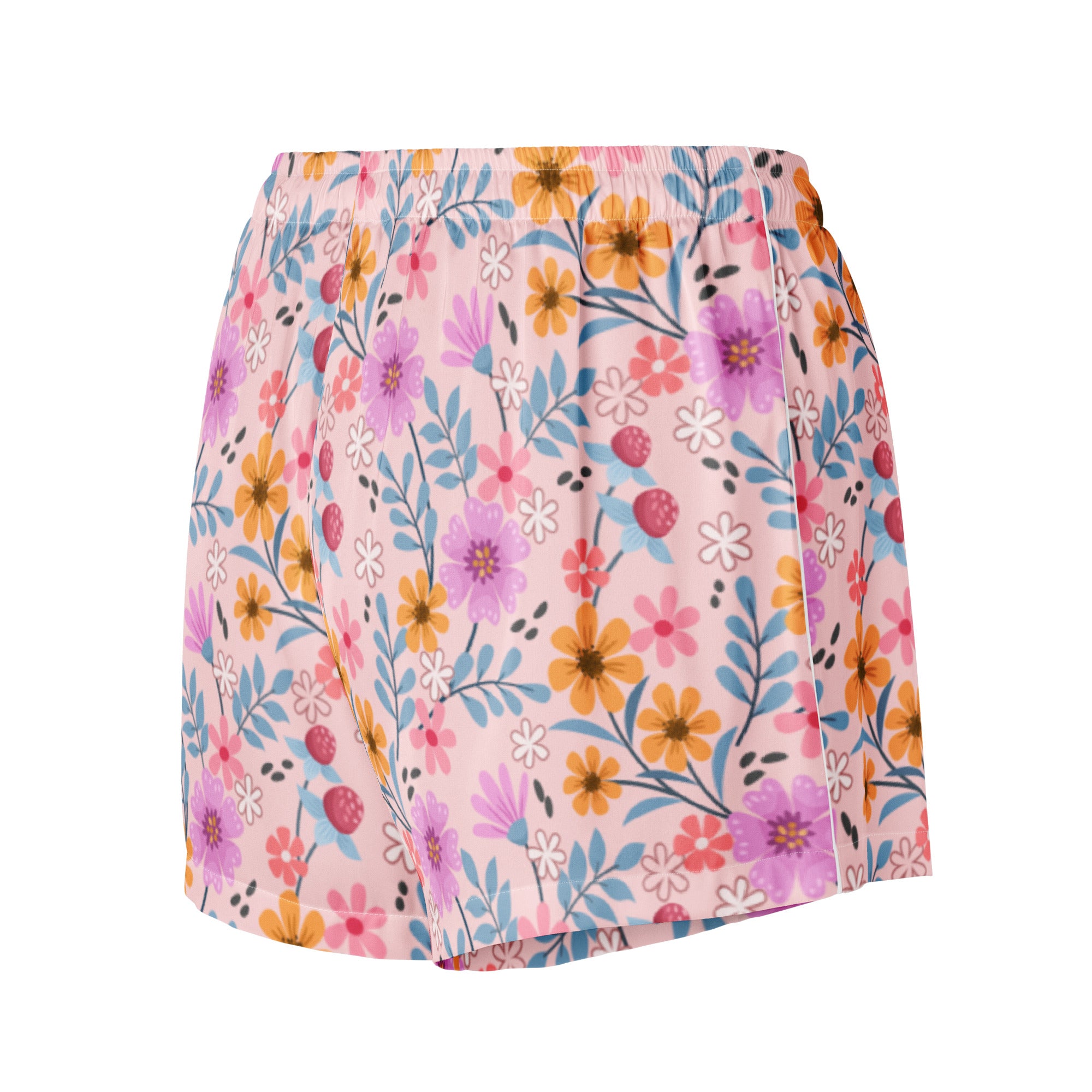 Women’s pink floral silky pajama shorts with vibrant purple orange and blue flowers on light pink lightweight fabric
