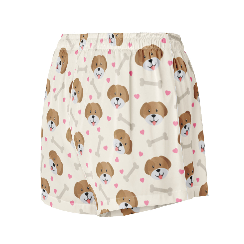 Women’s cream-colored silky pajama shorts with playful brown puppy faces pink hearts and gray bones lightweight relaxed fit