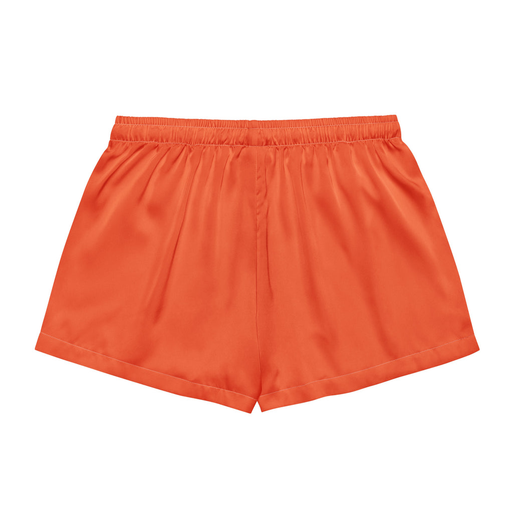 Bright orange silky satin pajama shorts for women with an elastic waistband and lightweight relaxed fit
