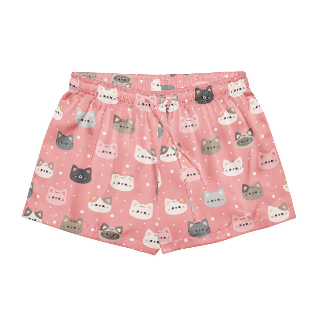 Women’s cute pink silky pajama shorts with playful white gray and black cartoon cat faces on a dotted background