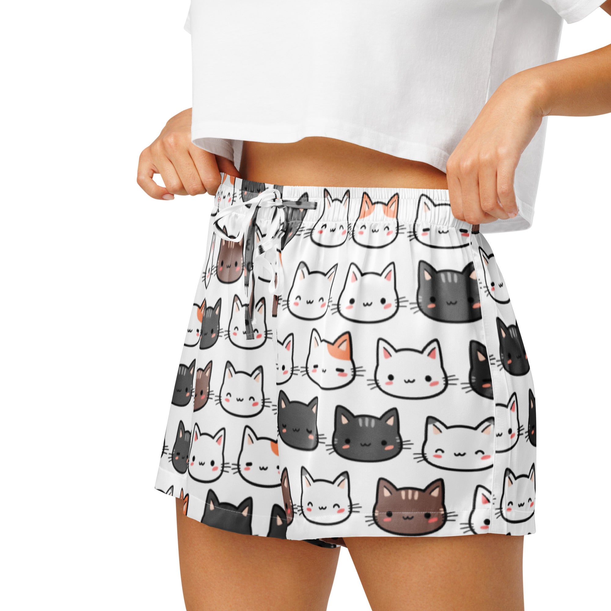 Women’s lightweight silky white pajama shorts with playful cartoon cat faces in black gray and brown with pink cheeks
