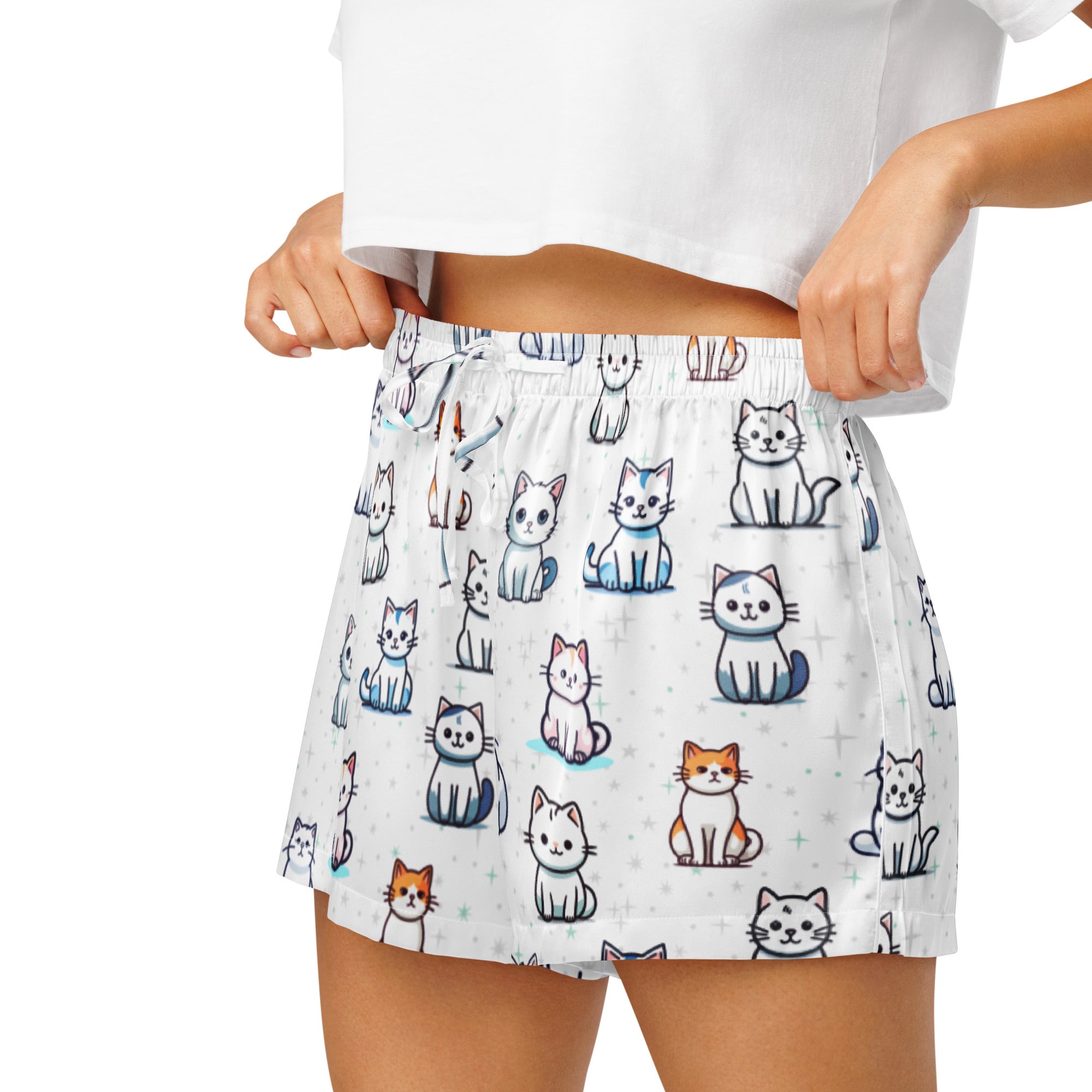 Women’s white silky pajama shorts with lightweight relaxed fit and playful colorful cartoon cat pattern with drawstring waist