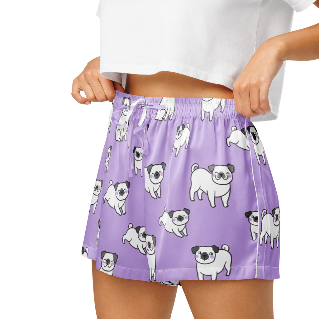 Women’s purple silky pajama shorts with a playful white and black pug pattern and a lightweight relaxed fit