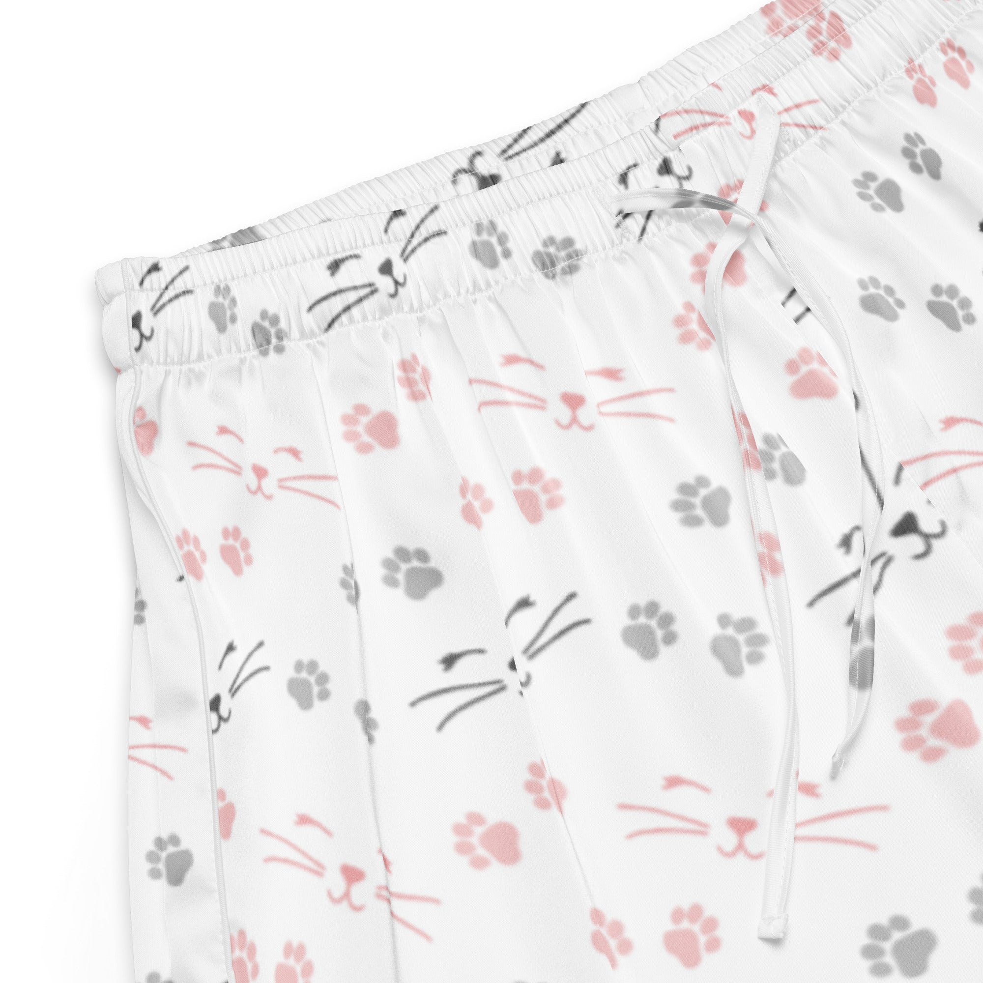 White silky pajama shorts with pink and gray cat faces and paw prints featuring a lightweight relaxed fit and drawstring waist
