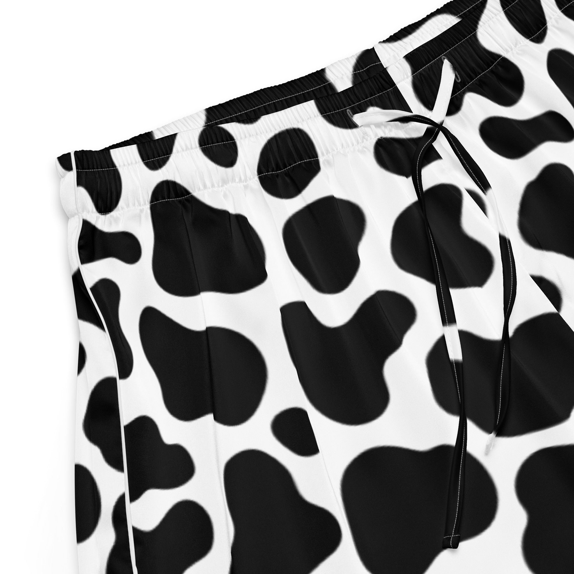 Women’s cow print silky pajama shorts in black and white with lightweight relaxed fit and drawstring waistband