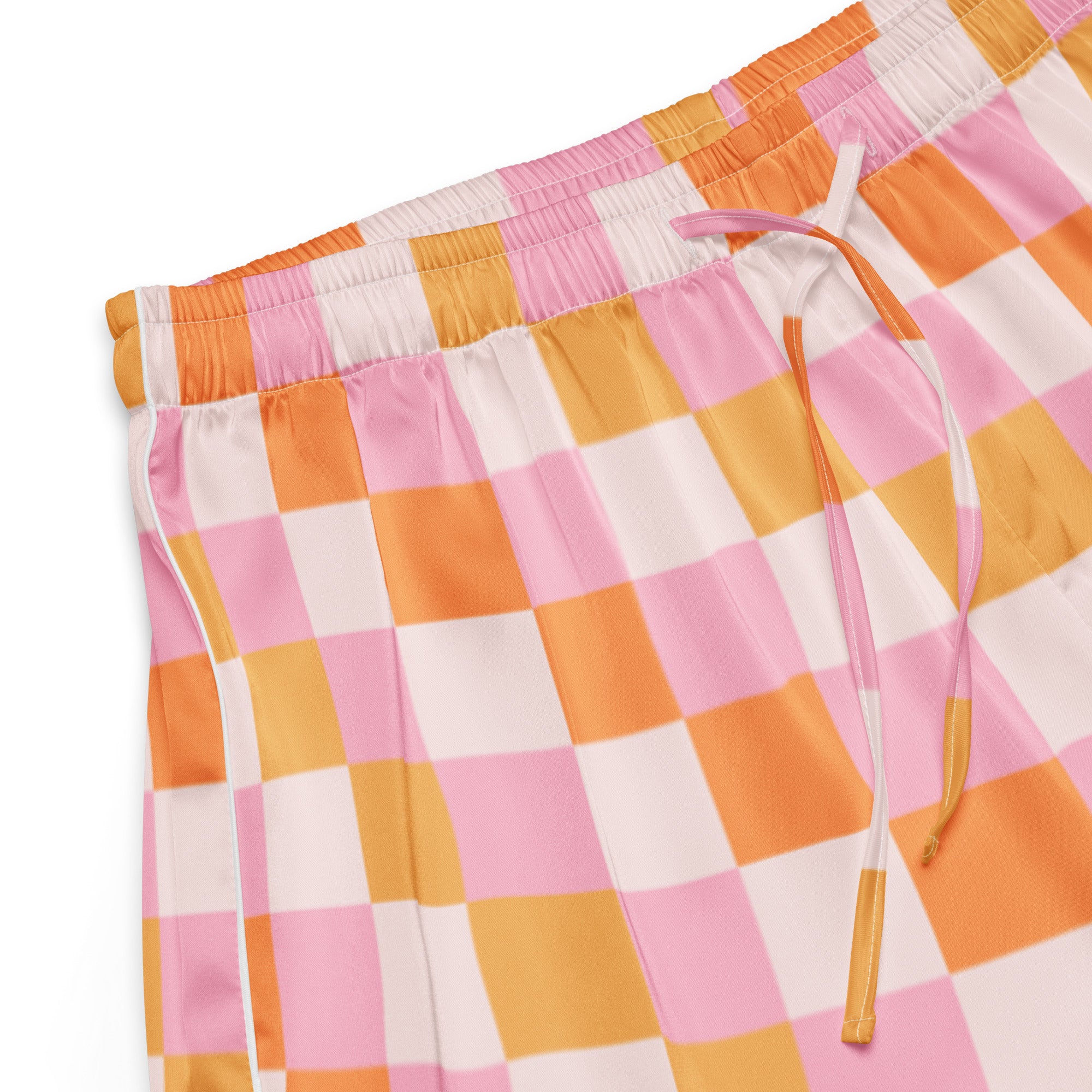 Women’s pink and orange checkered silky pajama shorts with white elastic waistband and matching drawstring for lightweight comfort