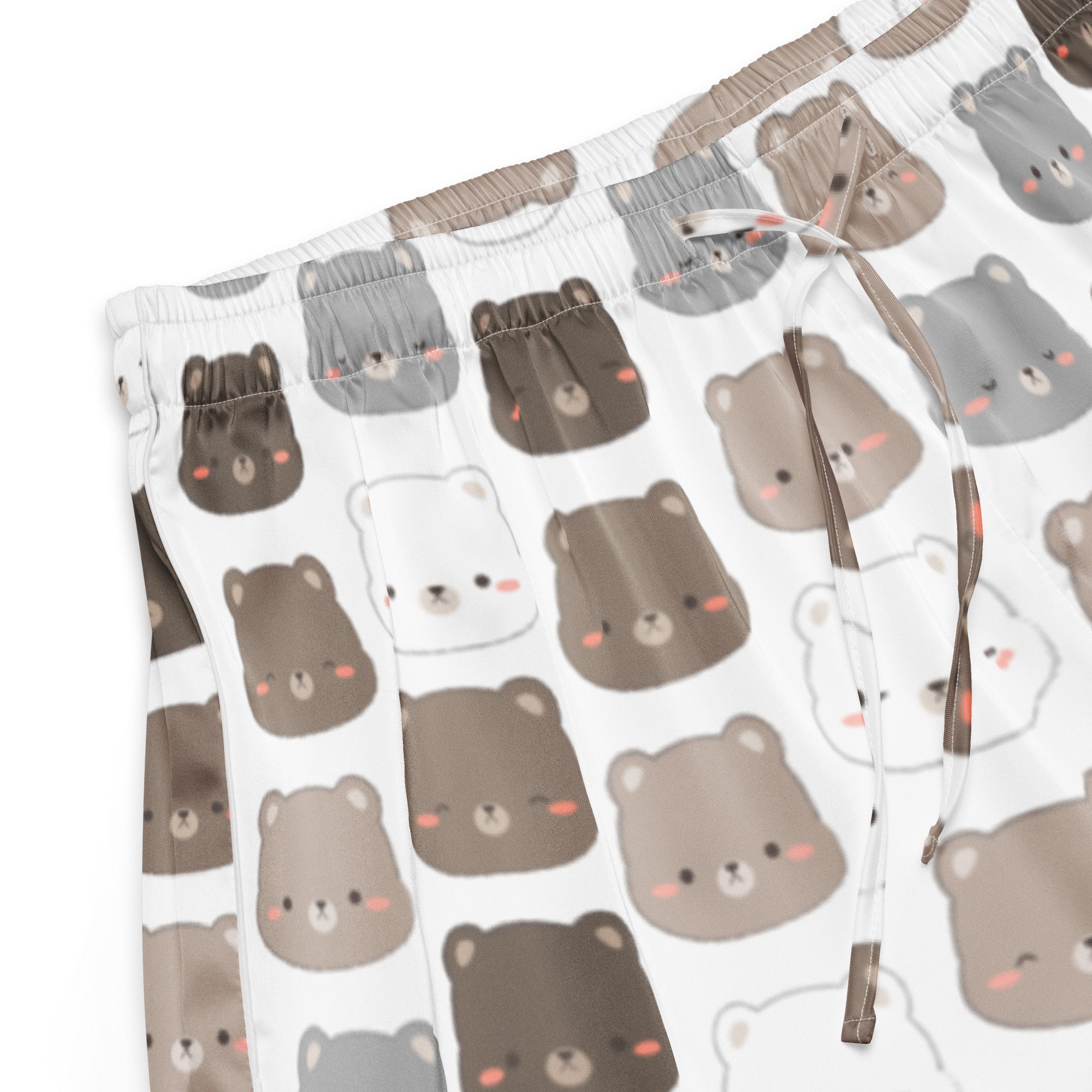 White silky pajama shorts with playful cartoon bears in brown gray and white featuring a drawstring waist