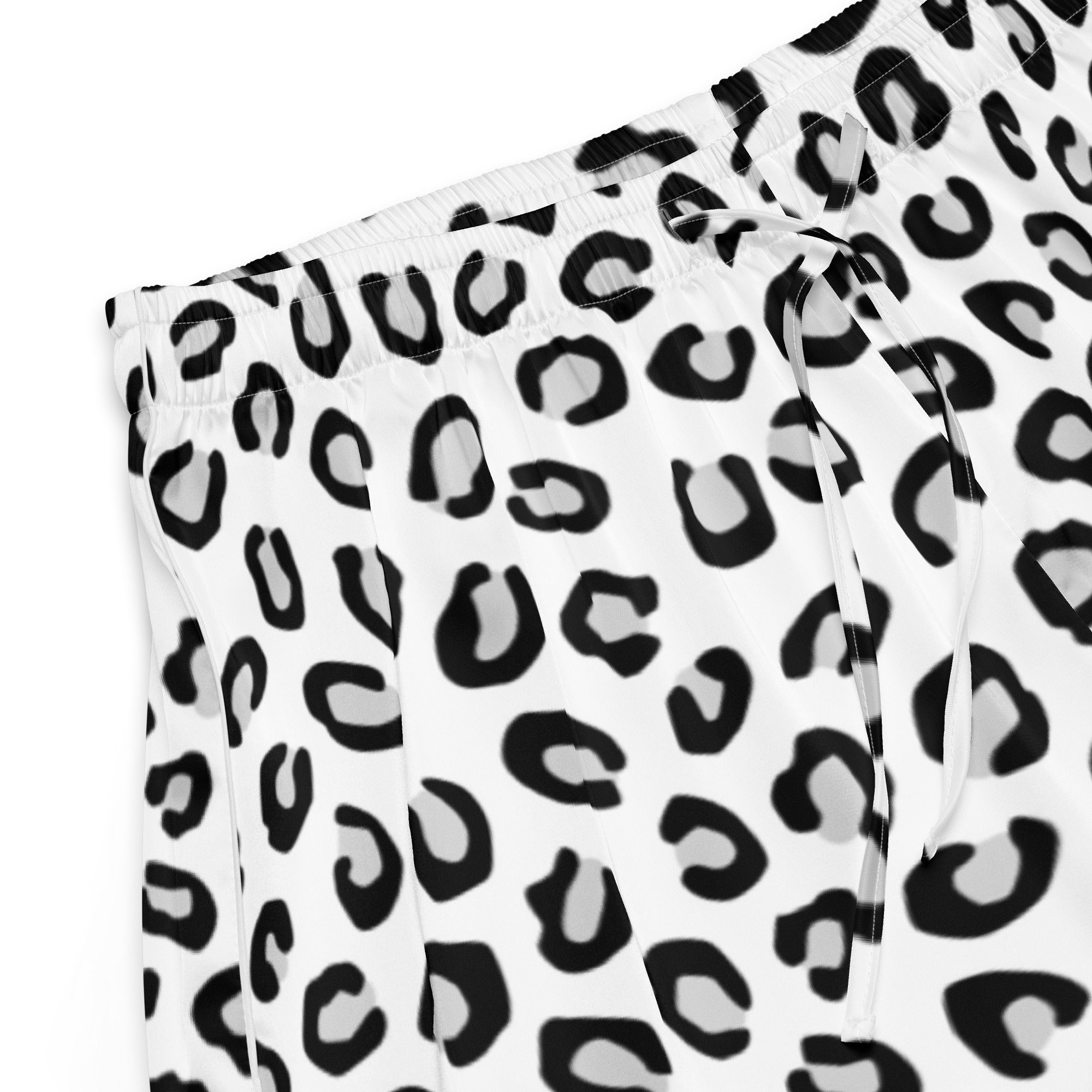 White silky pajama shorts with bold black leopard print, lightweight relaxed fit, and drawstring waist for women