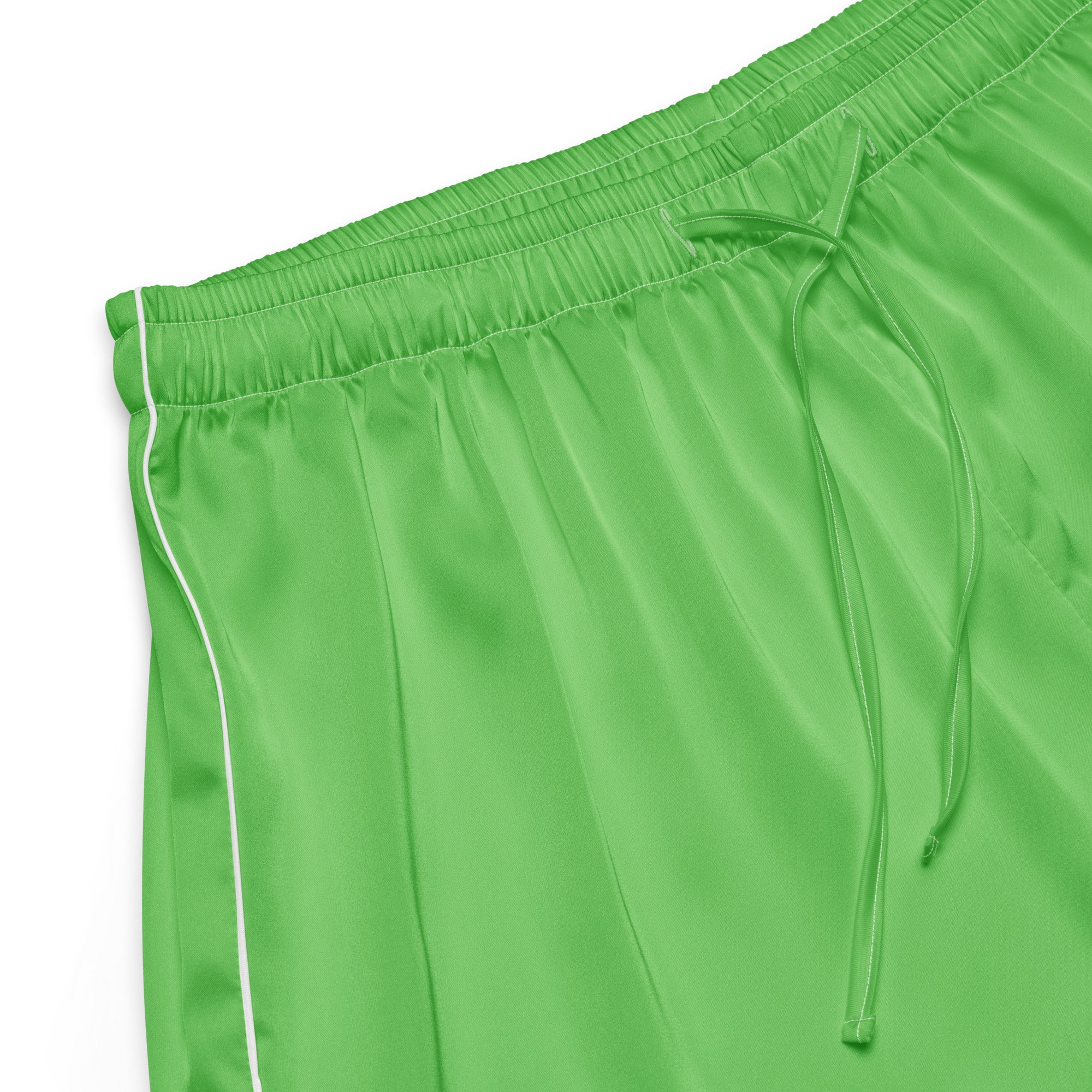 Women’s green silky pajama shorts with white piping side detail and elastic waistband with drawstring for lightweight comfort