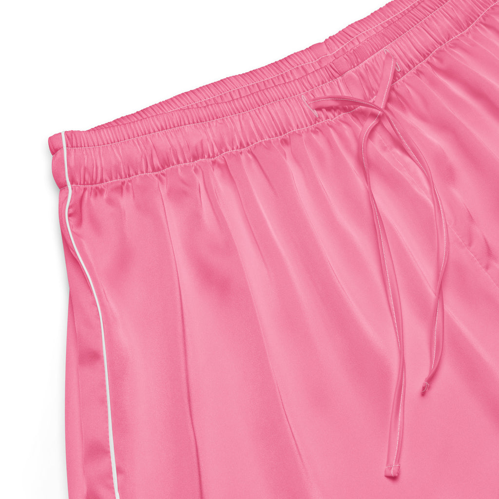 Women’s pink silky satin pajama pants with white piping side seam and matching drawstring waistband for comfort