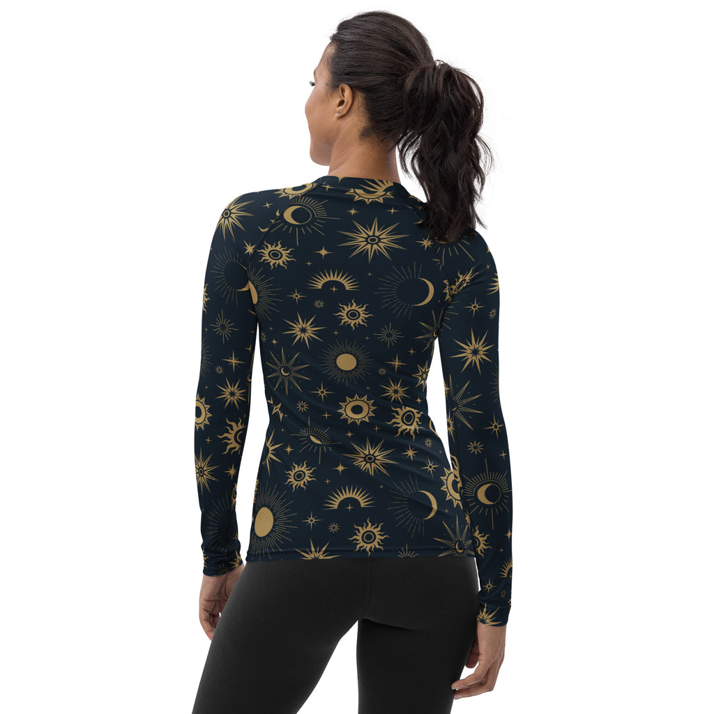 Dark blue womens long sleeve rash guard swim shirt with gold celestial sun moon star pattern and UPF 50 plus protection
