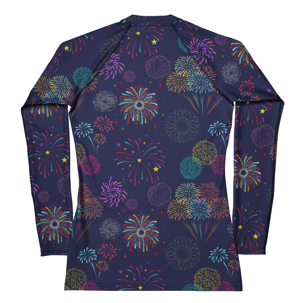 A navy blue long sleeve rash guard with colorful fireworks print in pink teal purple and gold buttery soft with UPF 50+