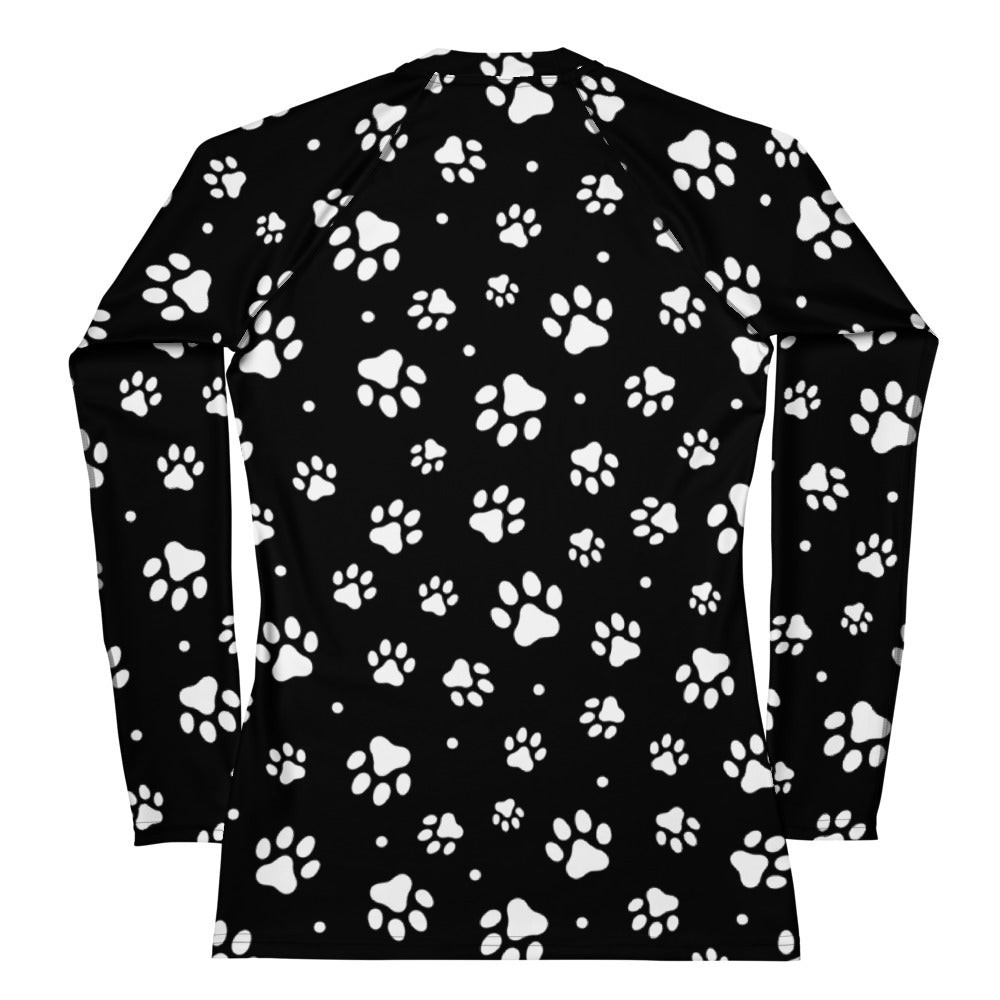 Women’s black long sleeve rash guard swim shirt with white paw print pattern and UPF 50 plus buttery soft fabric