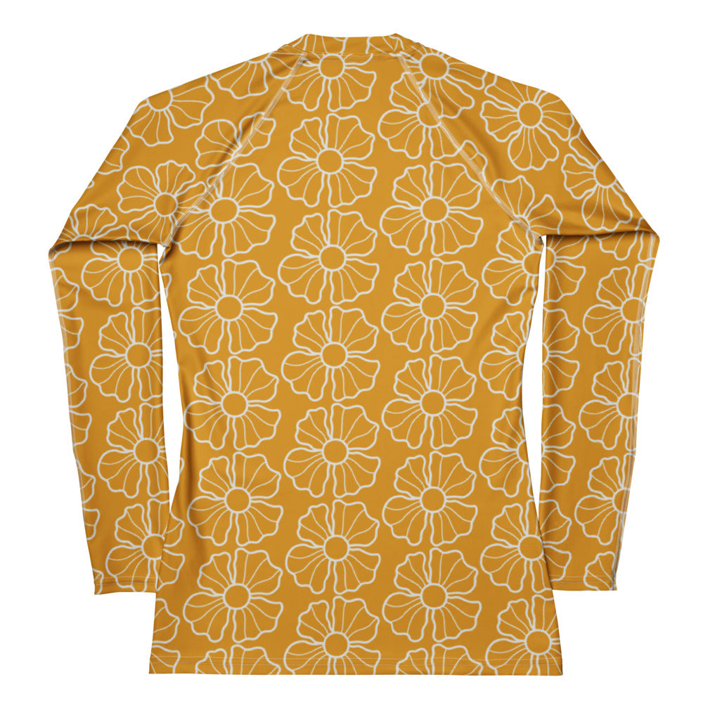 Women’s mustard yellow long sleeve rash guard with white floral pattern buttery soft fabric and upf 50+ protection