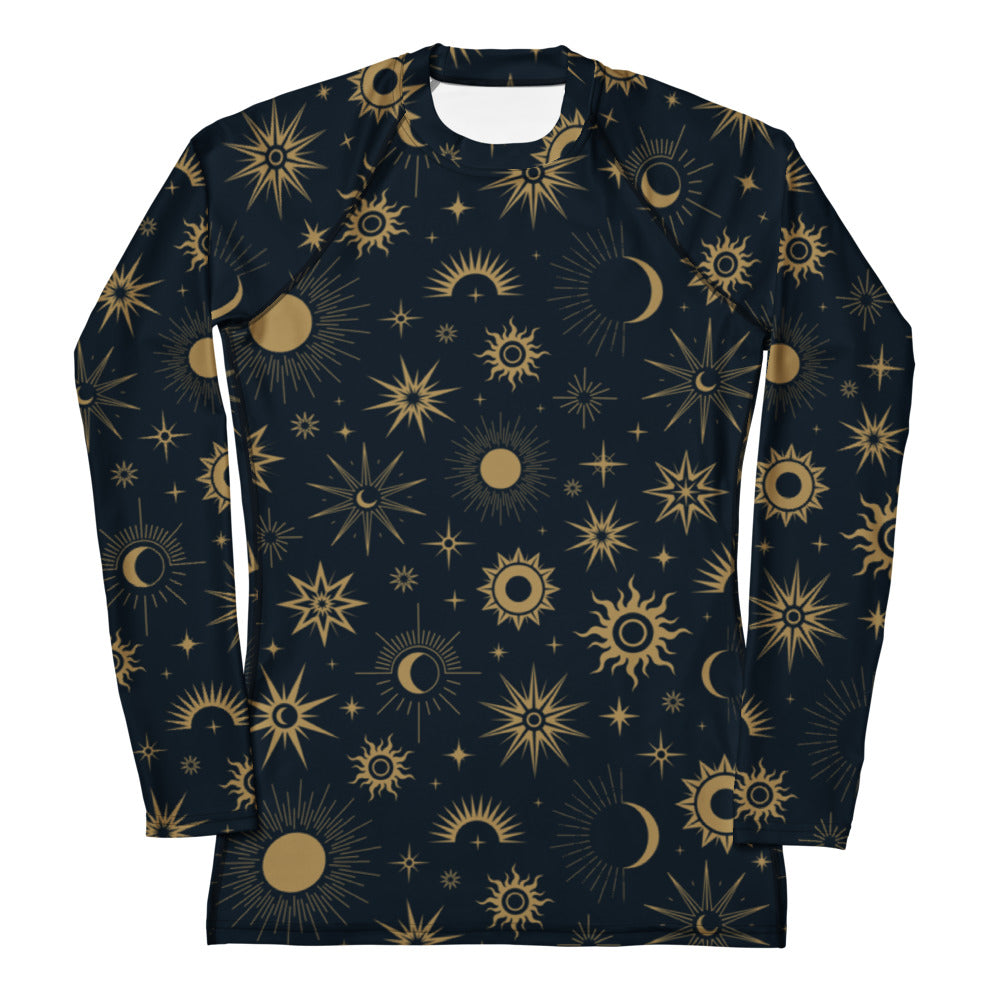 A navy blue long sleeve rash guard with a gold celestial sun moon star pattern and UPF 50 plus sun protection