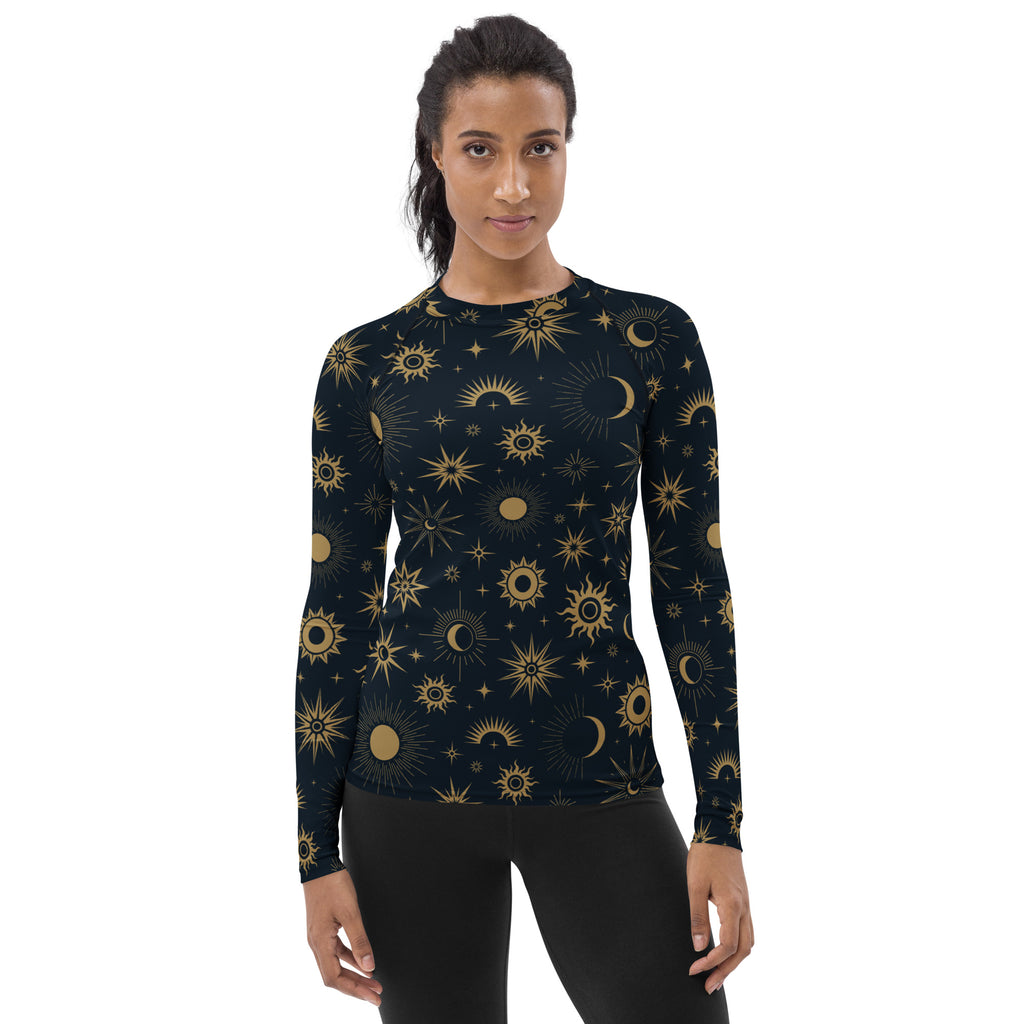 Women’s dark navy long sleeve rash guard swim shirt with buttery soft fabric and gold celestial sun moon star pattern