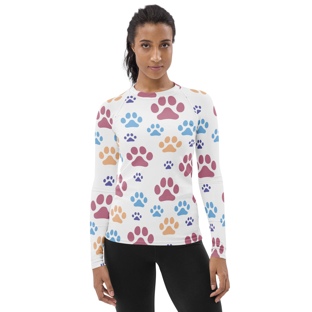 White long sleeve buttery soft rash guard swim shirt with colorful pink blue and orange paw prints and UPF 50+ protection