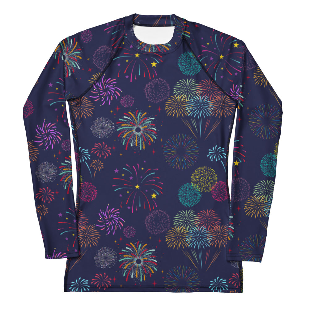 A navy blue long sleeve rash guard with colorful fireworks print made of buttery soft fabric with UPF 50 plus protection