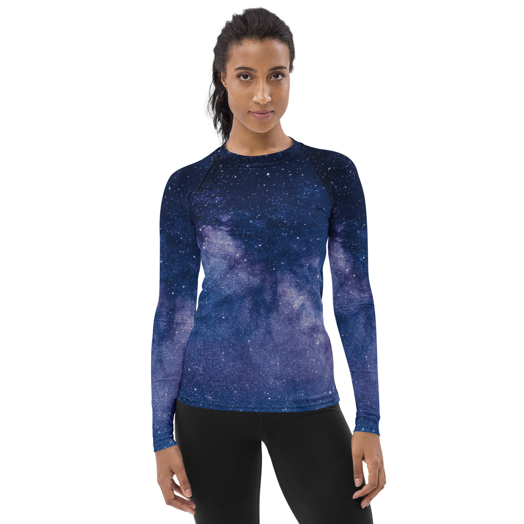 Women’s long-sleeve rash guard swim shirt in deep blue to purple galaxy print with upf 50+ buttery soft fabric