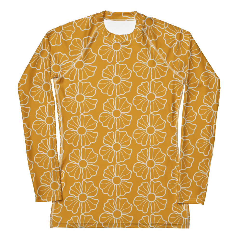 A mustard yellow long sleeve rash guard with white floral outlines made of buttery soft fabric and UPF 50 plus protection