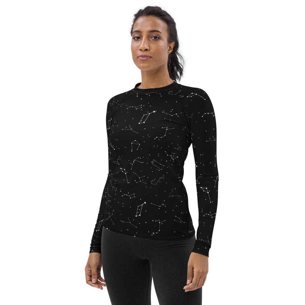 Women’s black long sleeve rash guard swim shirt with subtle white constellation pattern and upf 50 plus protection