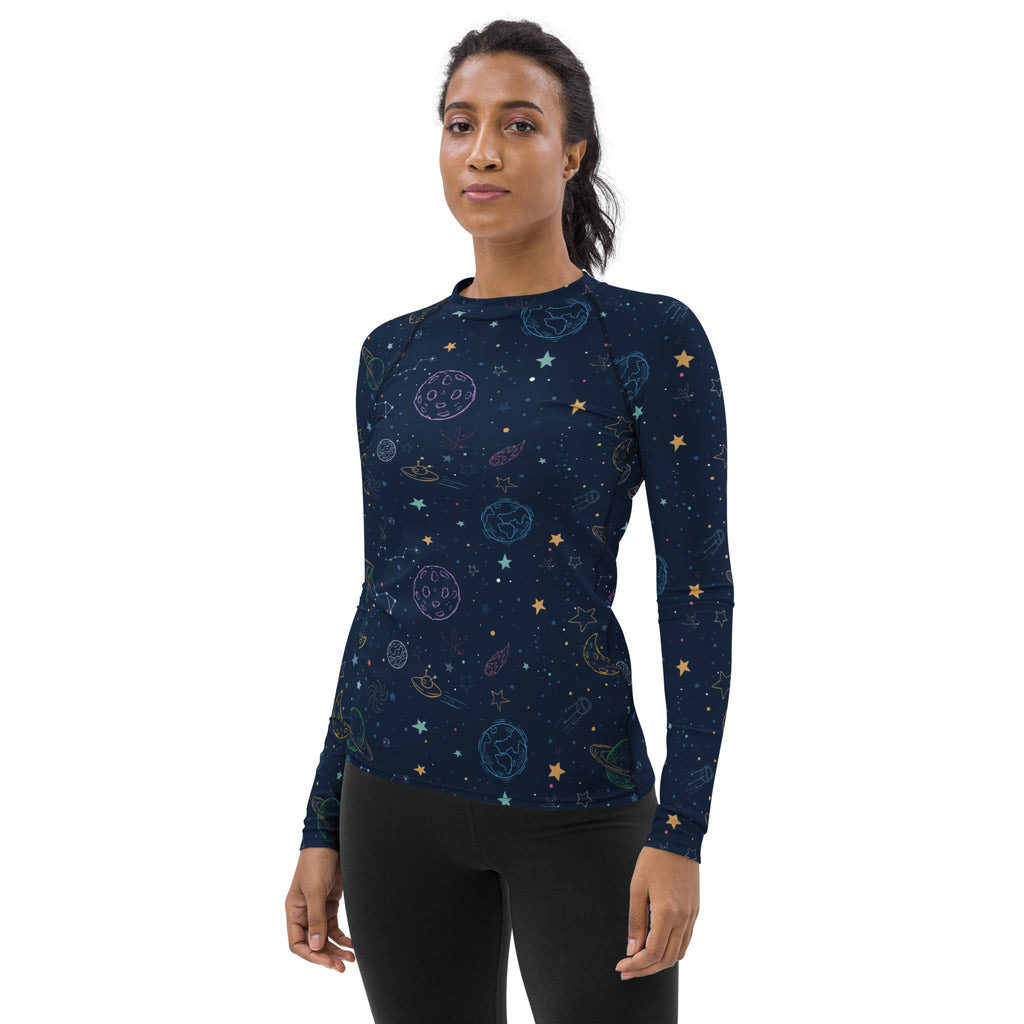 Navy blue womens long sleeve rash guard with playful pastel space print and UPF 50 plus buttery soft fabric