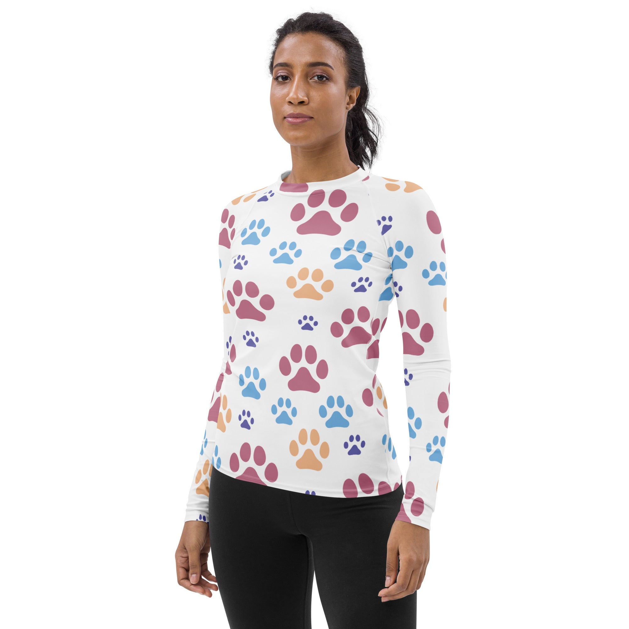 White long-sleeved buttery soft rash guard swim shirt with colorful paw prints and upf 50 plus protection