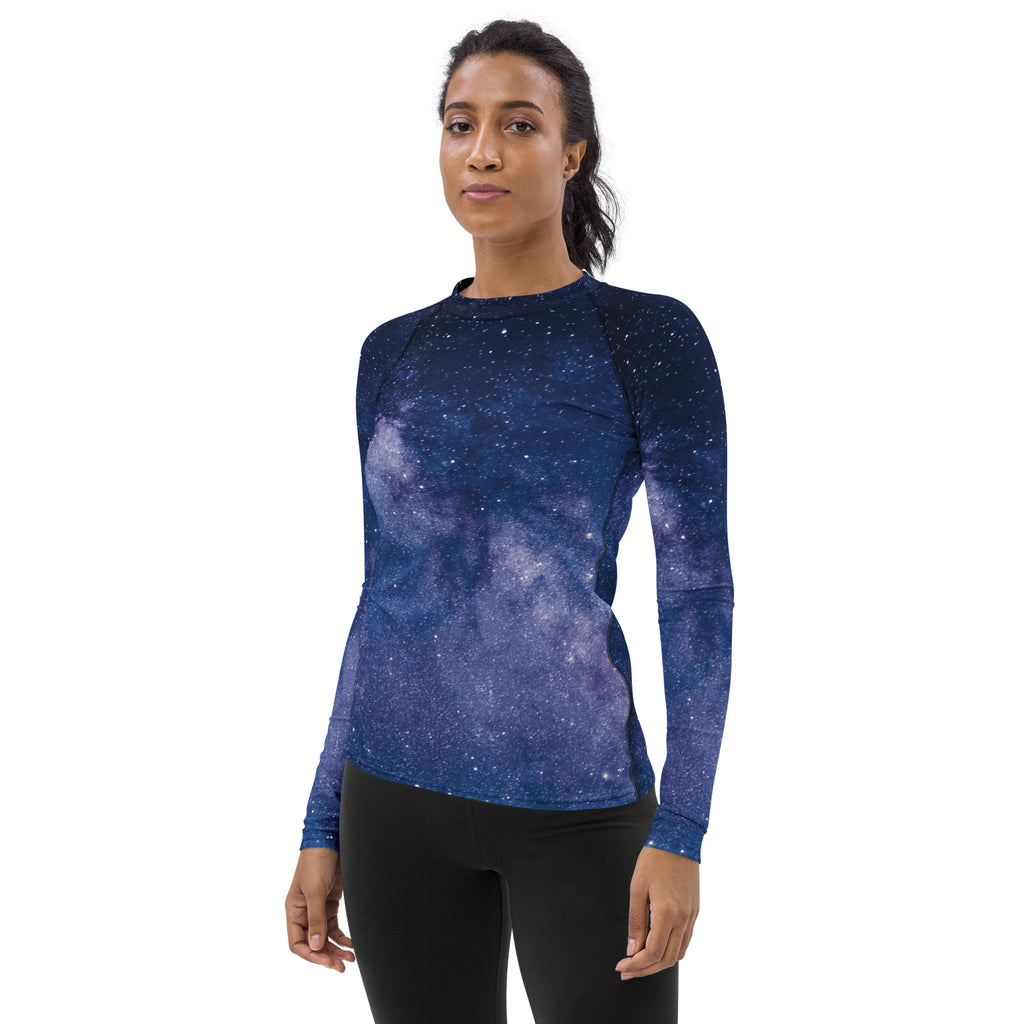 Women’s long-sleeved form-fitting rash guard swim shirt with galaxy print in deep blue to purple gradient and upf 50+ protection