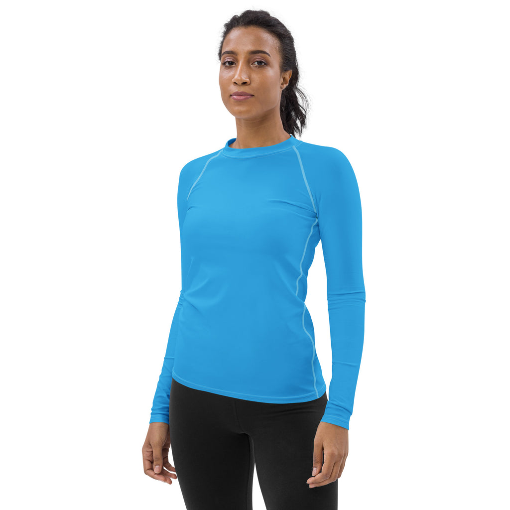 Women’s sky blue long sleeve rash guard swim shirt with UPF 50 plus in buttery soft fabric and white seam detailing