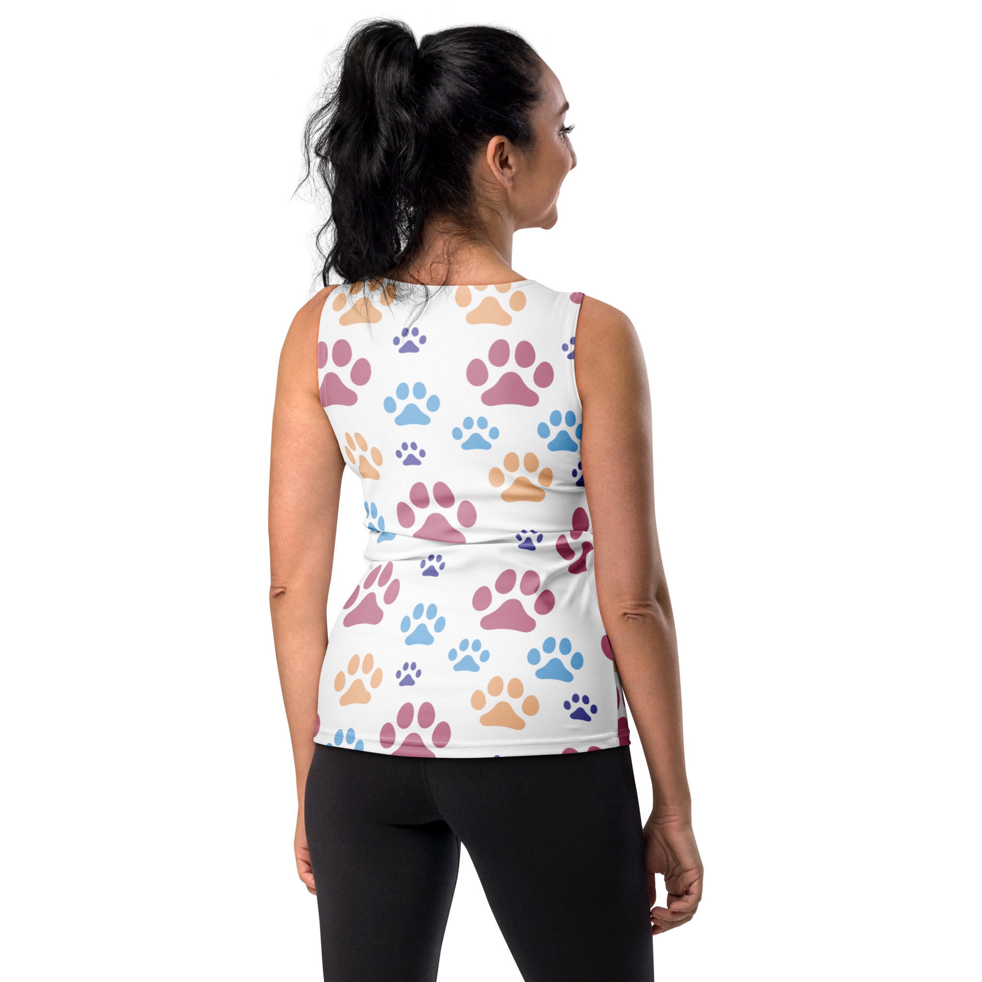 White sleeveless tank top with colorful paw print pattern in pink blue and tan made of quick drying buttery soft fabric with upf 50+