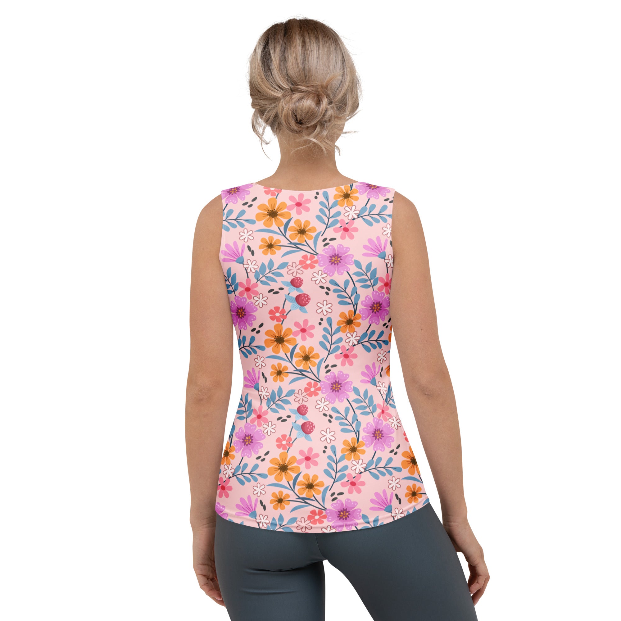 Women’s pink floral tank top with vibrant purple and orange blossoms and blue leaves in buttery soft quick drying fabric with upf 50+