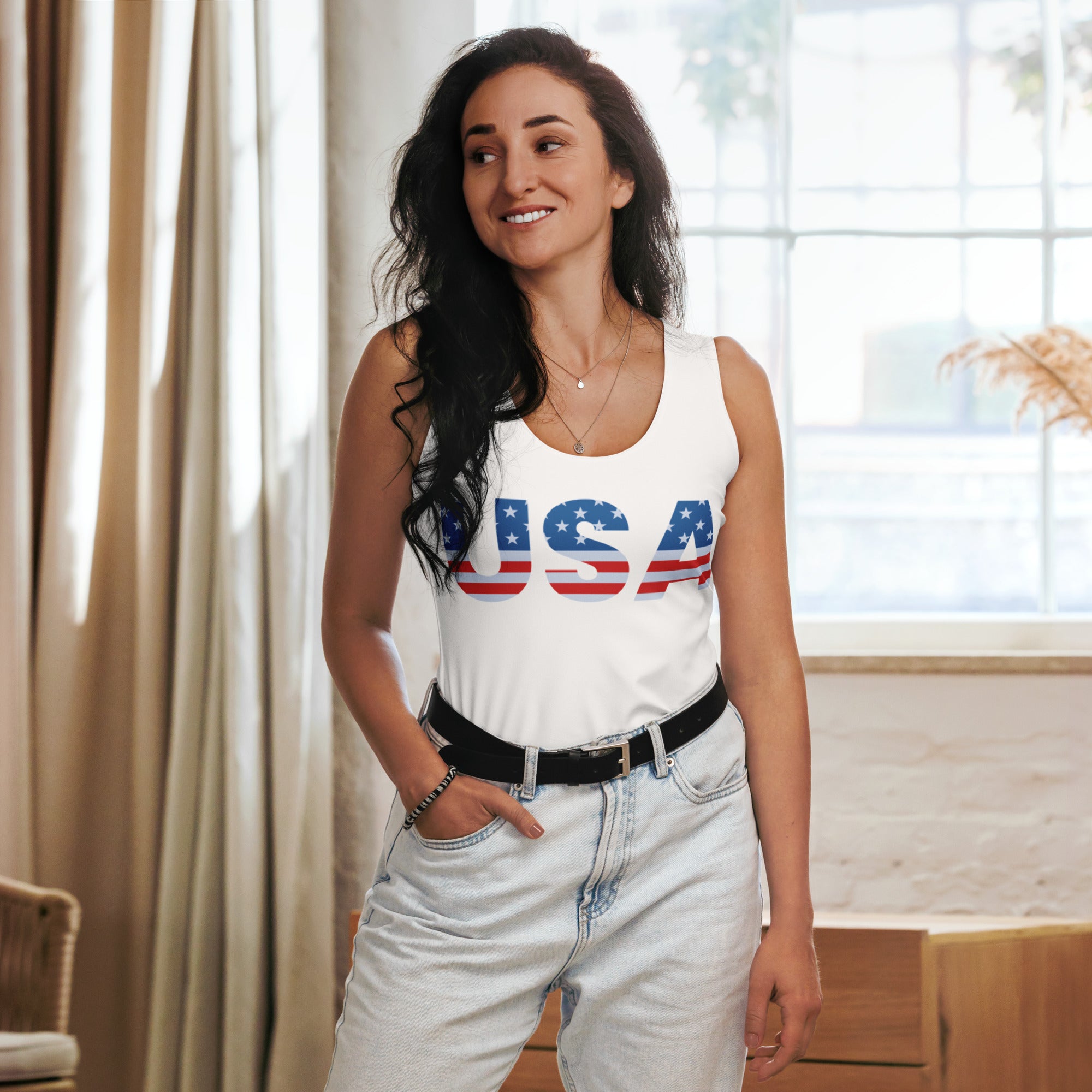 White sleeveless women’s usa tank top with bold red white and blue star lettering made from quick drying buttery soft fabric with upf 50+