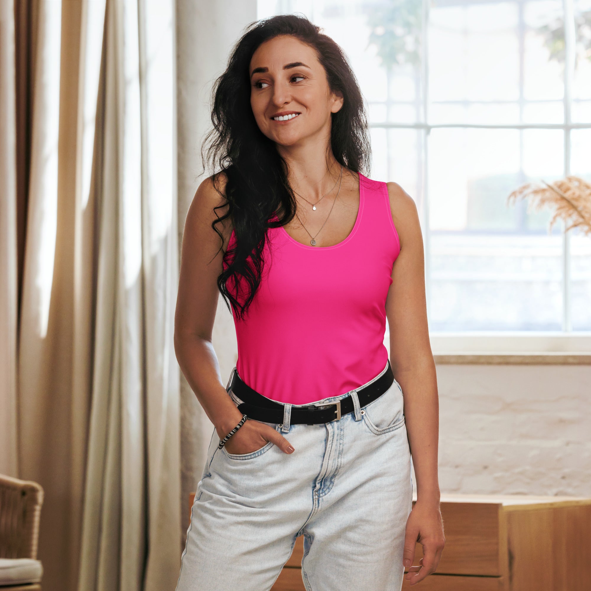 Vibrant pink sleeveless tank top with a simple round neckline made from quick drying buttery soft fabric with UPF 50+