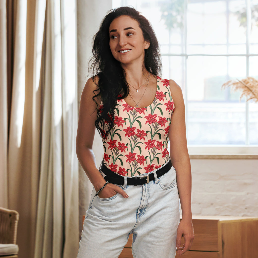 Women’s cream sleeveless top with red lily pattern and green stems made from quick drying buttery soft fabric with upf 50+