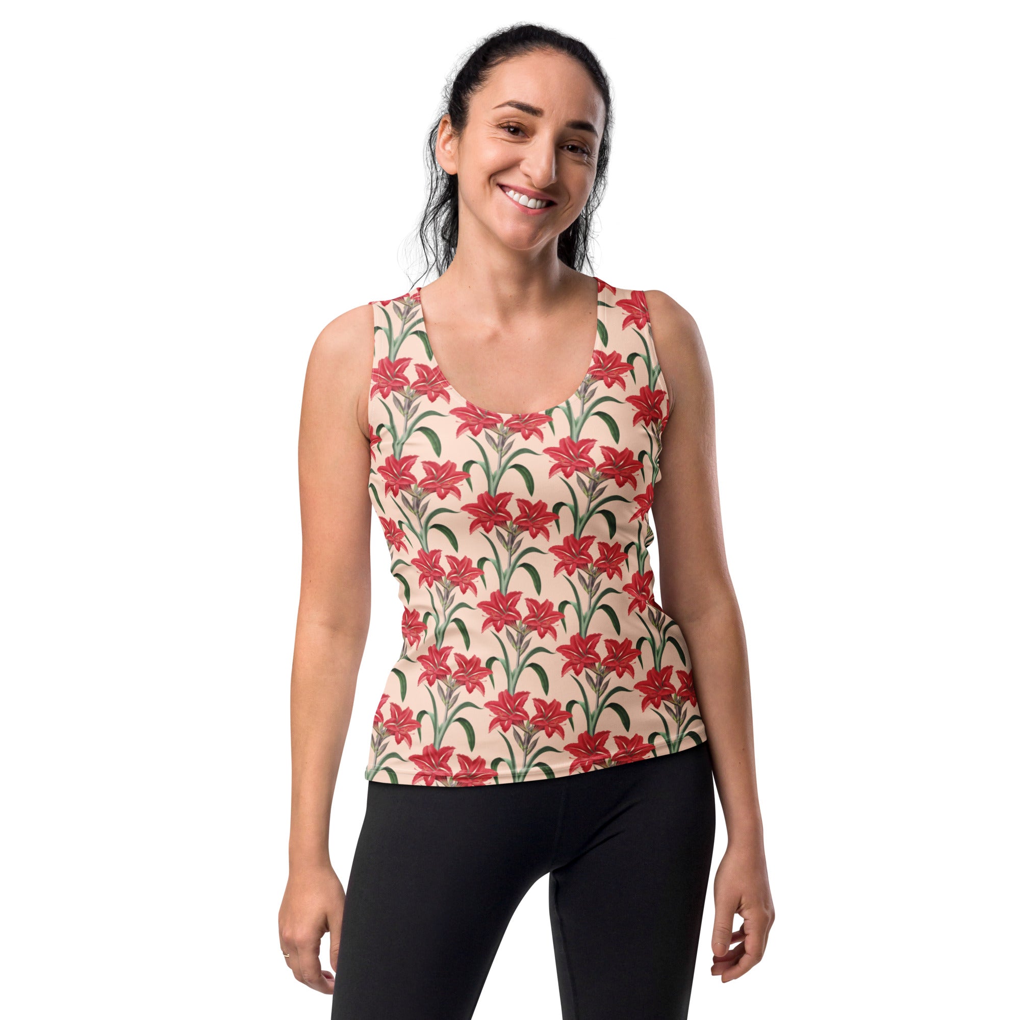 A woman wears a women’s cream and red lily floral tank top with quick drying buttery soft fabric and upf 50+ protection