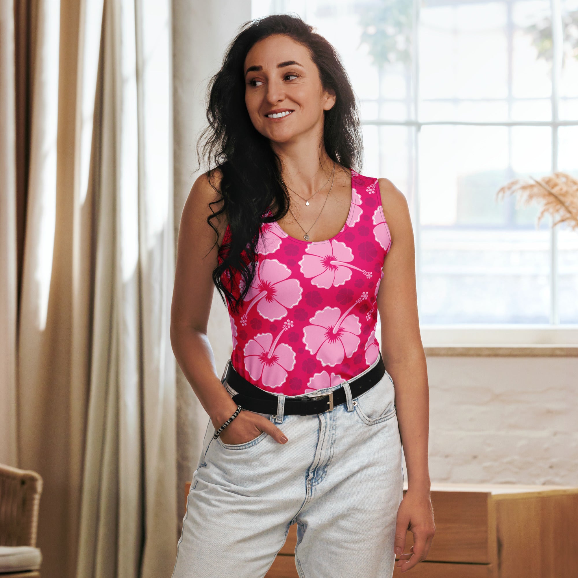 A vibrant pink sleeveless tank top with light pink hibiscus floral pattern made of quick drying buttery soft fabric with UPF 50+