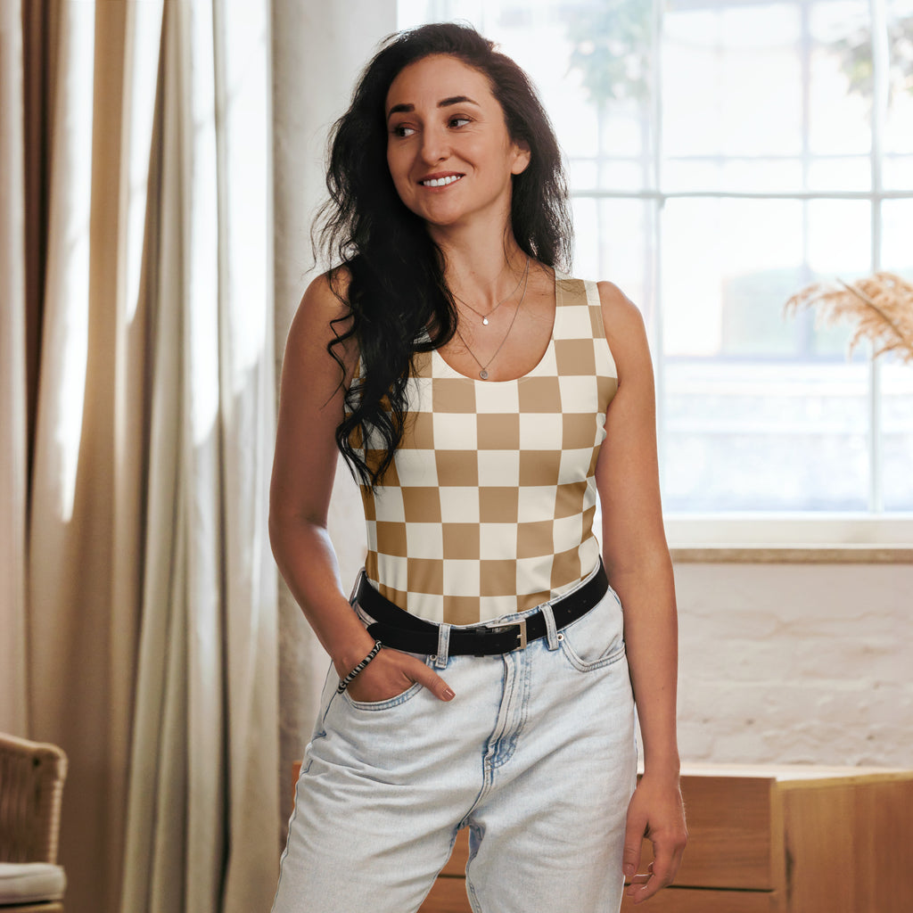 A woman wears a women’s beige checkerboard tank top with quick drying buttery soft fabric and UPF 50+ protection