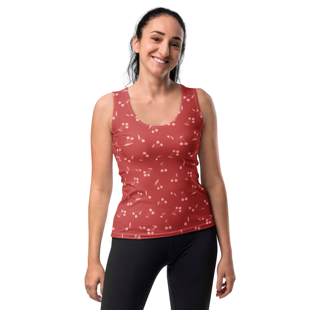A red cherry-print sleeveless tank top with scoop neckline in buttery soft quick drying fabric with UPF 50+ protection