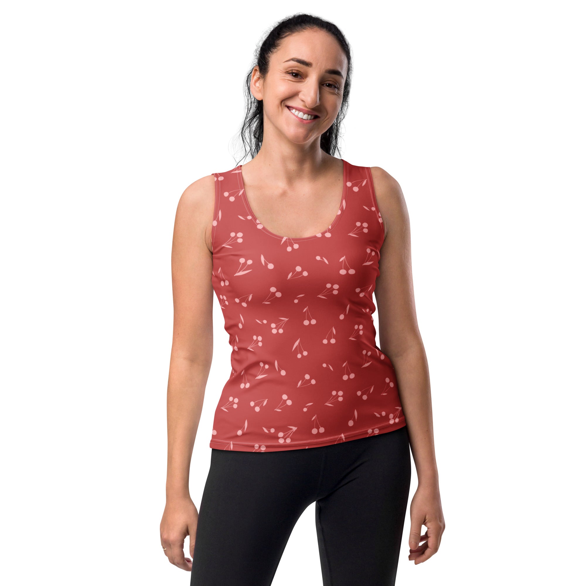 A red cherry-print sleeveless tank top with scoop neckline in buttery soft quick drying fabric with UPF 50+ protection