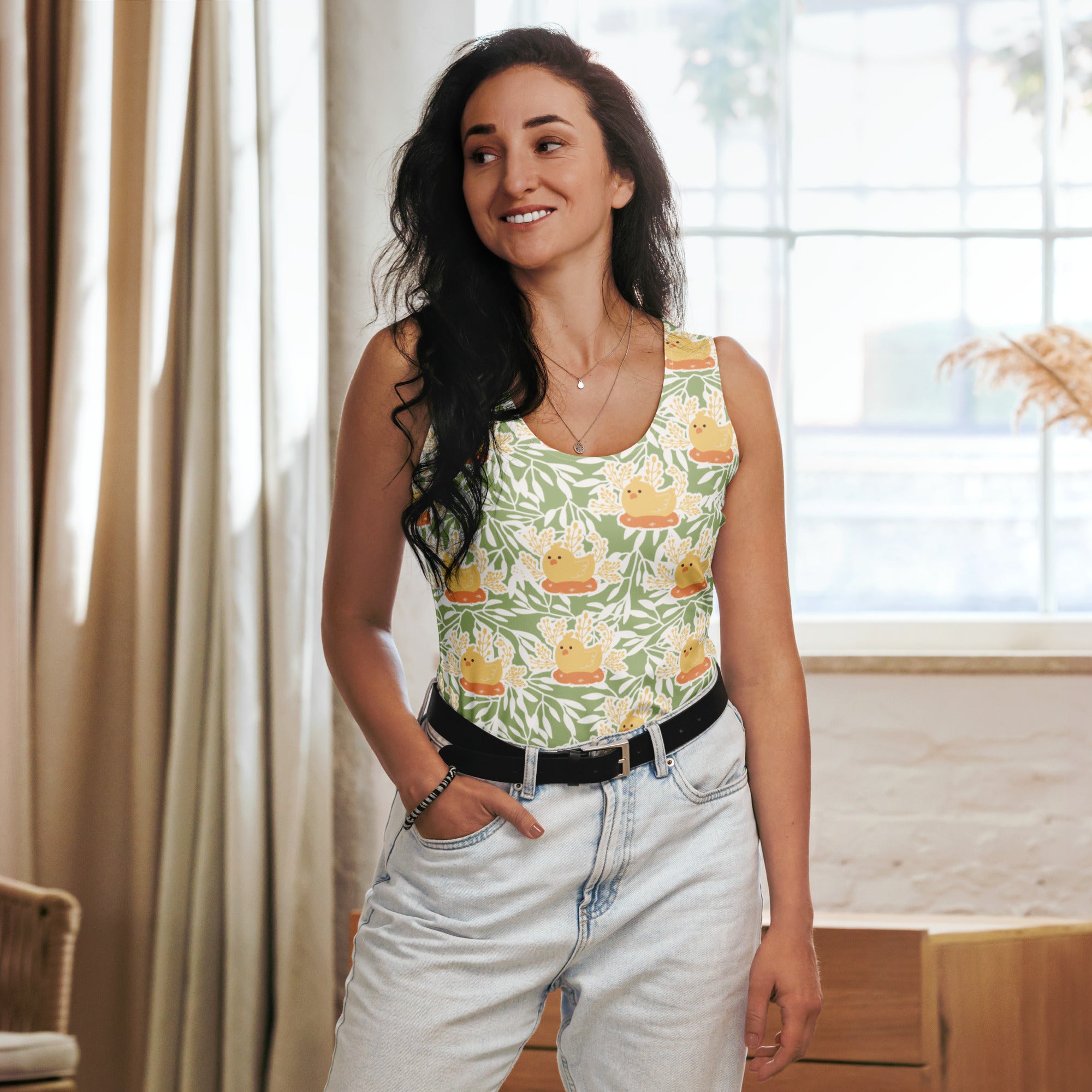 Women’s sage green tank top with playful yellow rubber duck and white vine pattern made of quick drying buttery soft fabric with UPF 50+