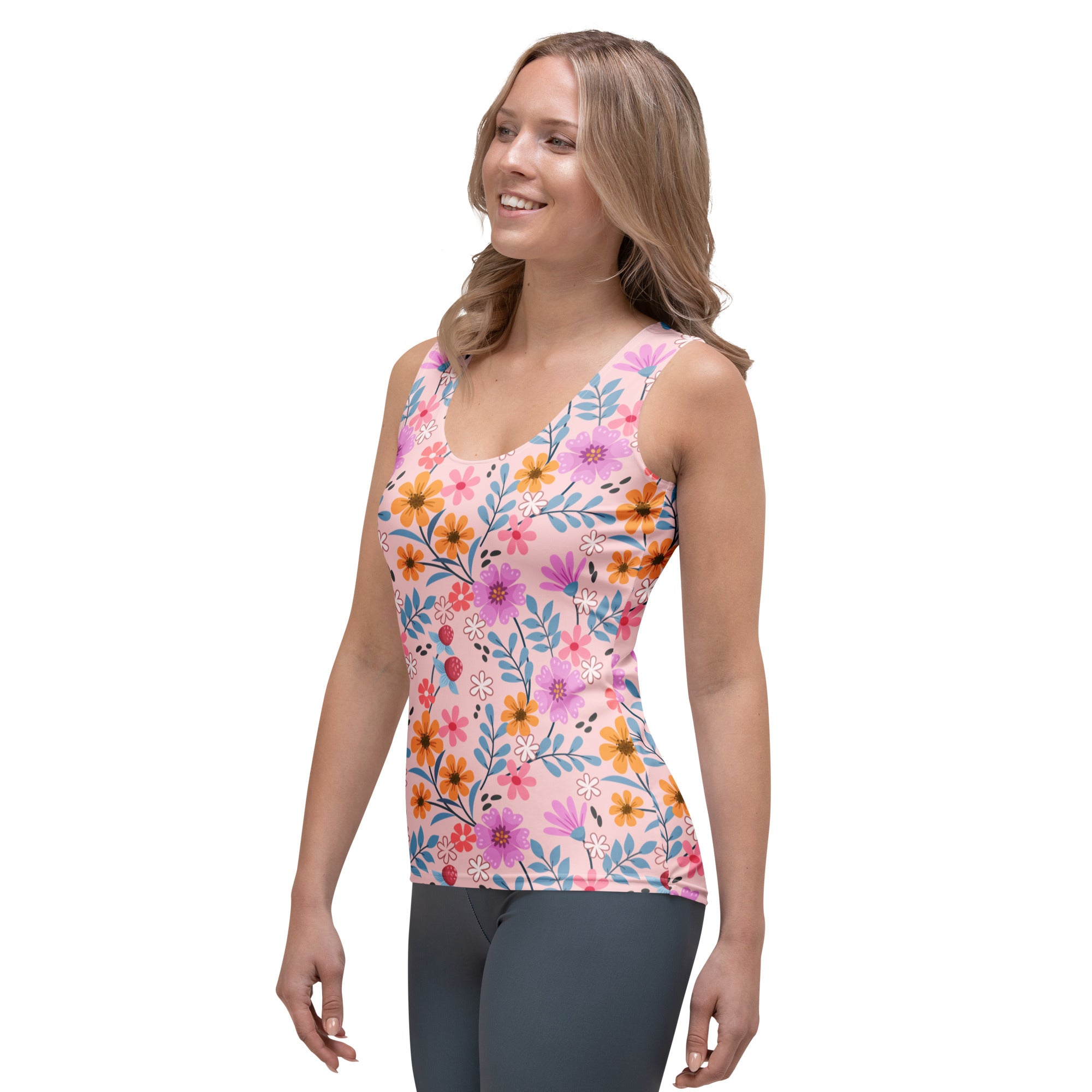 Women’s pink floral tank top with vibrant orange purple and blue flowers made of quick drying buttery soft fabric with UPF 50+