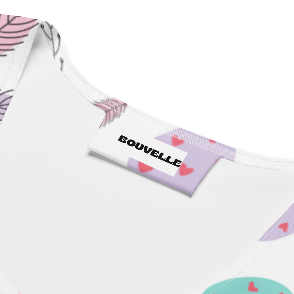 Women’s white bouvelle tank top with pink feather and red heart pattern made of quick drying buttery soft fabric with upf 50+
