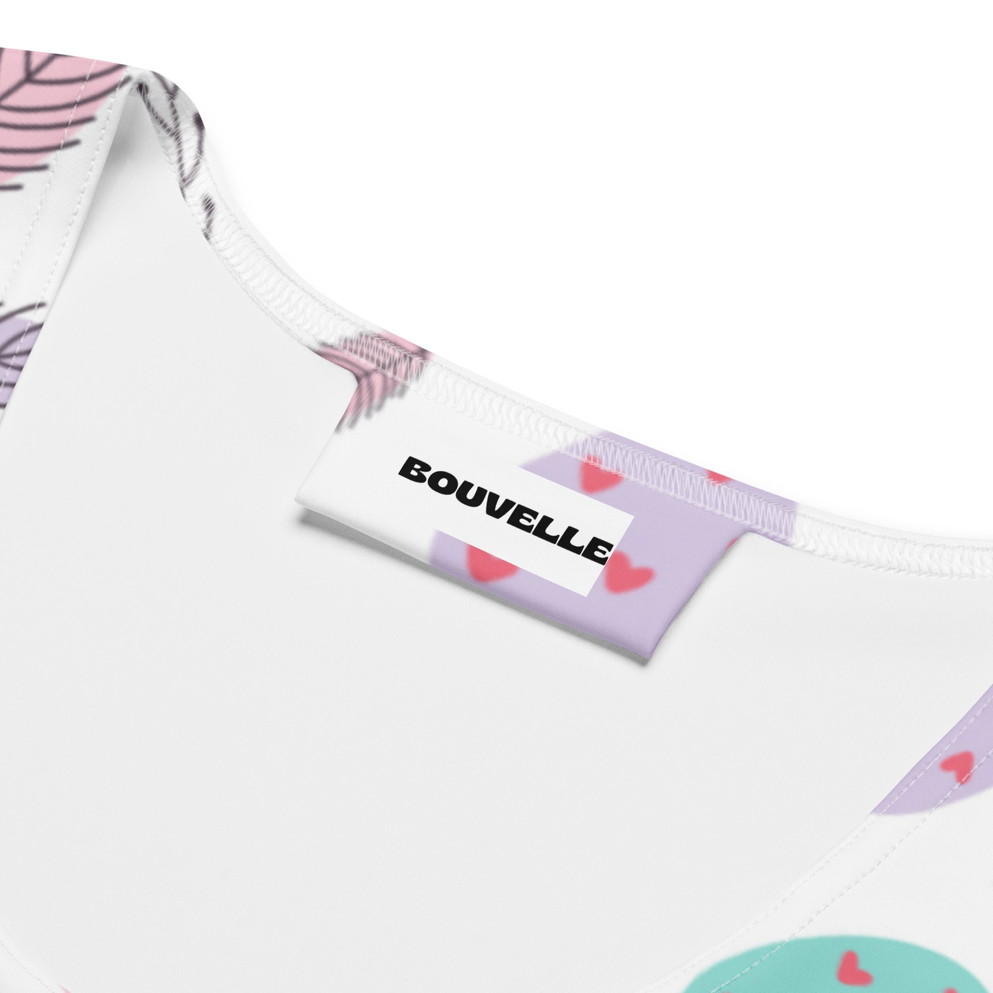 Women’s white bouvelle tank top with pink feather and red heart pattern made of quick drying buttery soft fabric with upf 50+