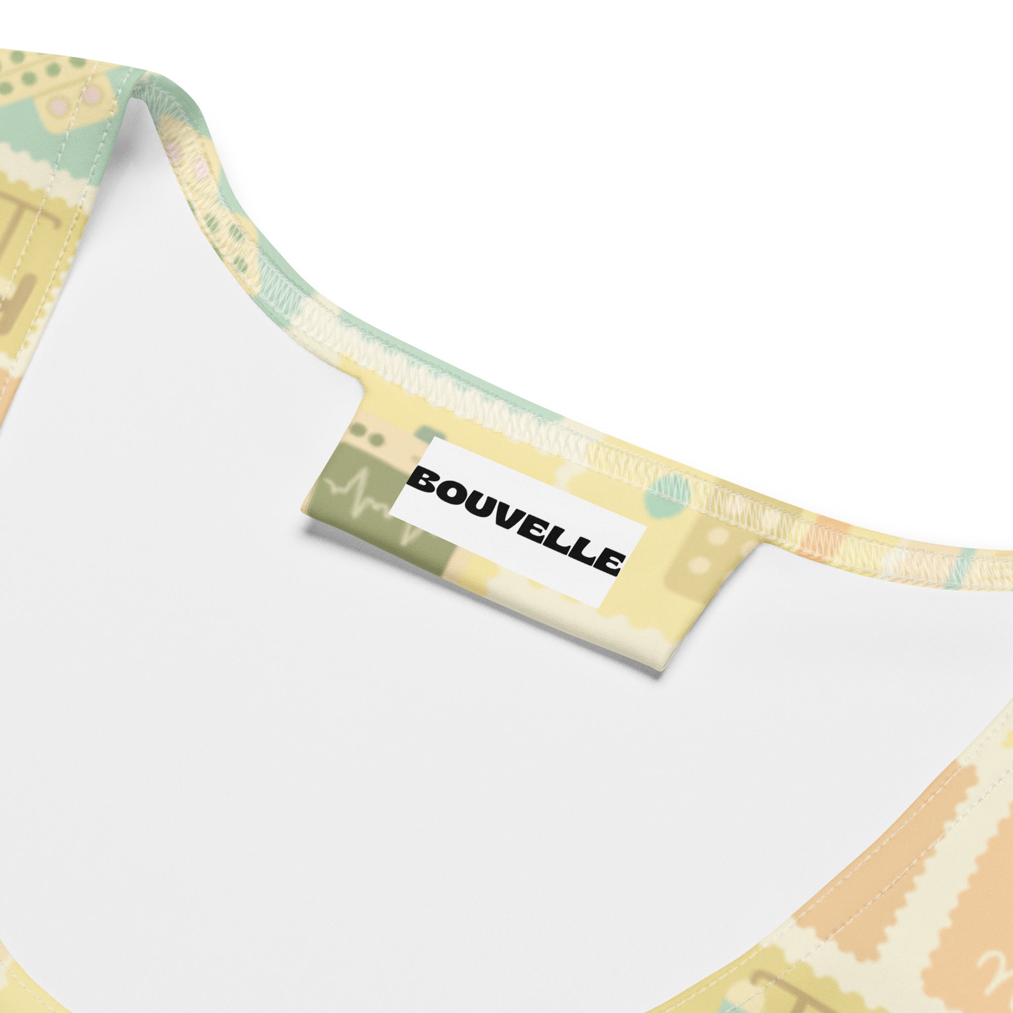 A pastel-colored soft fabric strap with whimsical abstract shapes on a women’s yellow nurse icon quick drying tank top
